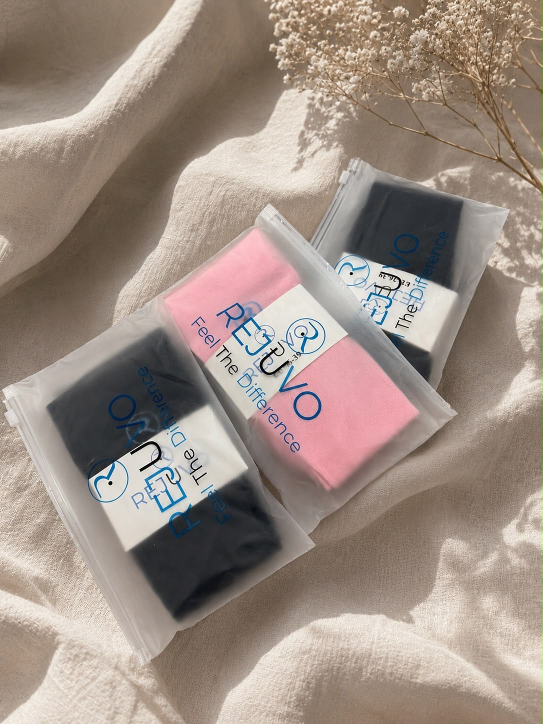 Rejuvo compression socks in reusable branded packaging
